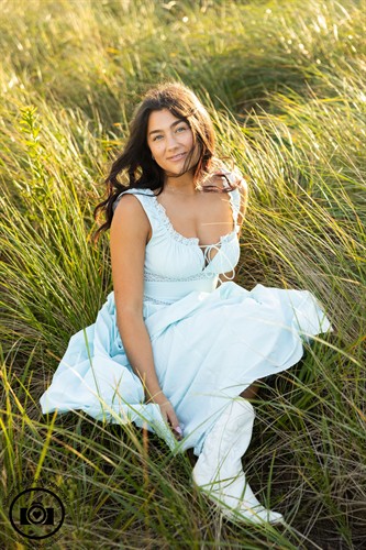 Senior portraits in the beach grass of Wingaersheek Beach