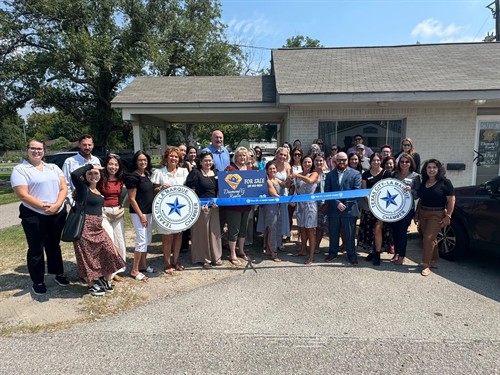 Cutting the ribbon our new office!!