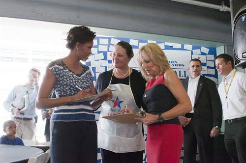 First Lady Michelle Obama and 2nd FIrst Lady Dr. Jill Biden wearing our aprons! First Lady Michelle Obama and 2nd FIrst Lady Dr. Jill Biden wearing our aprons!