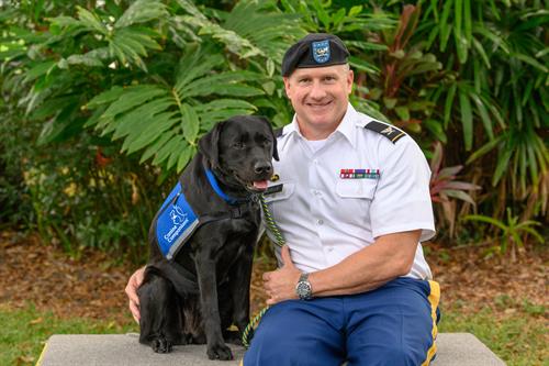 A Canine Companions client, a veteran, with his service dog. 