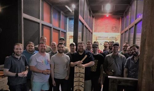 Group of friends axe throwing