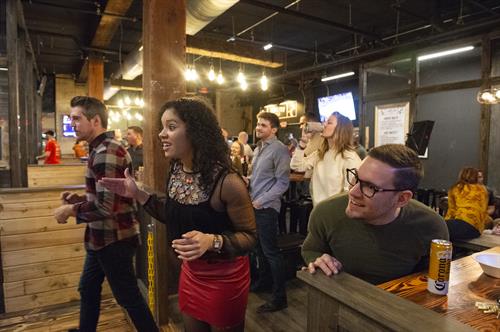 Group of friends axe throwing in Dueling Axes