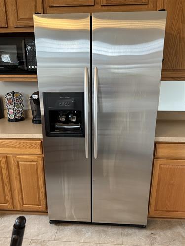 Before: A refrigerator door marred by streaks and smudge