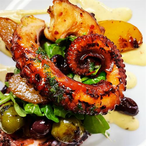 Seared octopus arugula| fingerling potatoes| olives| saffron aioli