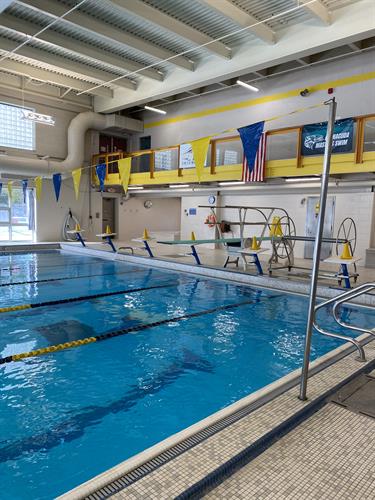 25-yard glass-enclosed indoor swimming pool with six lap lanes and a diving board!