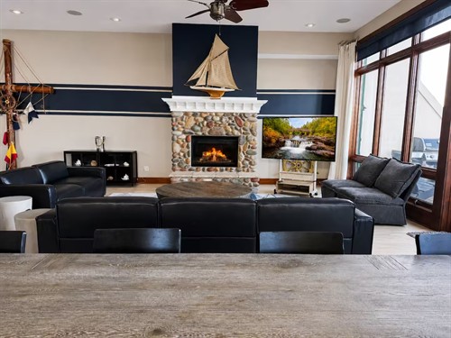 Nautical has a beautiful fireplace and 65" smart TV