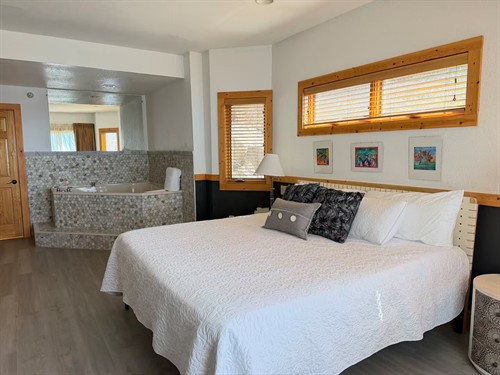Primary king suite with large corner jetted tub