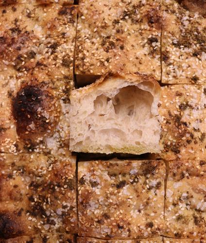 House Focaccia made with locally milled organic flour and topped with rotating seasonal ingredients