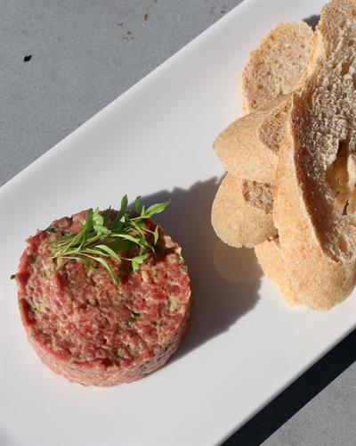 Steak Tartare hand chopped Buckner Ranch filet mignon tossed in dijonaise served with crostini