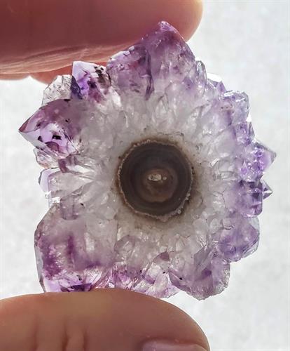 Gallery Image Amethyst_polished_slice_from_a_stalactite-like_crystal_formation.jpg