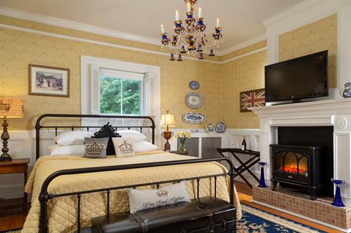 Elegant king bedroom with a romantic fireplace
