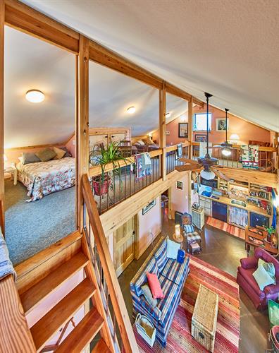 Lodge Bedroom 2 with Queen, Full & Twin Beds, Game & Sitting Areas.  Access via Ladder pictured. 