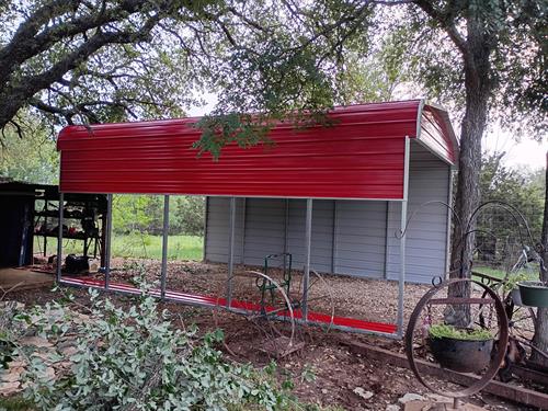 Featuring Cardinal Red Regular Carport w/ one side closed.