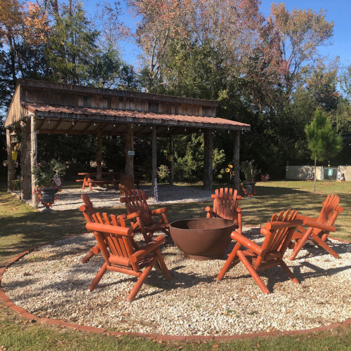 Covered pavilion and fire pit area – ideal for cookouts, gatherings, and relaxing evenings.