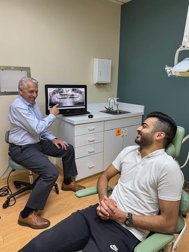 Saline Oral Surgeon Cass Radecki, DDS with Patient Saline Oral Surgeon Cass Radecki, DDS with Patient