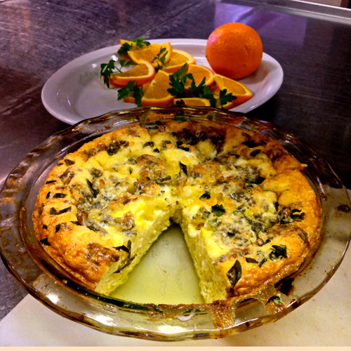 Morning breakfast includes a hot entrée, alternating between sweet (such as crepes or pancakes) and savory (such as quiche pictured here) choices.