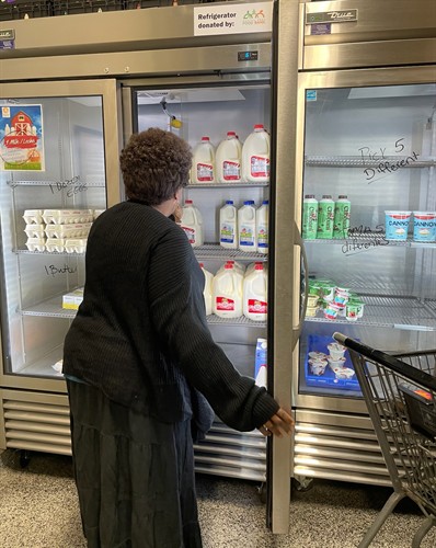 WFCM client selecting dairy products.
