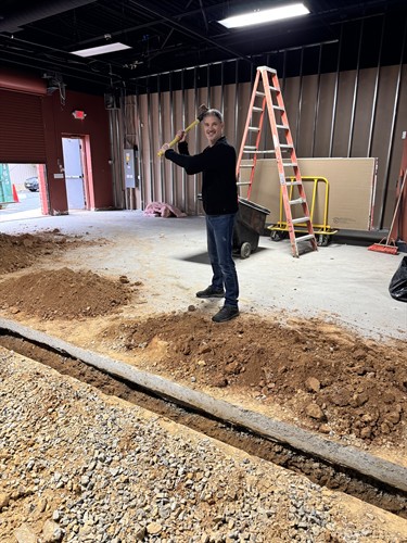 Jeff at SWEAT440 Reston During Buildout with Sledgehammer! 