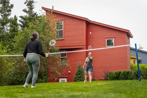 Guests playing lawn games on the property.