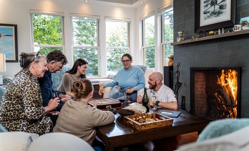 Guests playing board games in the main living room.