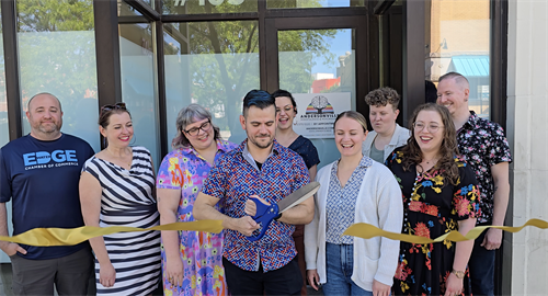 Photo of our ribbon cutting ceremony at our AMP Open House on June 20, 2025