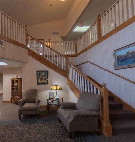 While a spacious lobby features a grand staircase, elevator access is available