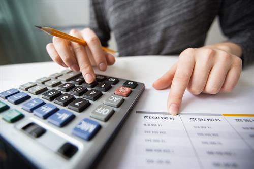 Gallery Image closeup-accountant-hands-counting-calculator.jpg