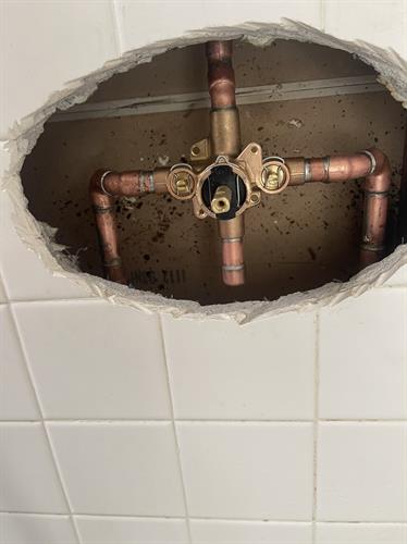 Moen Posi-temp shower valve installed with remodel plate to cover oval hole cut in tile