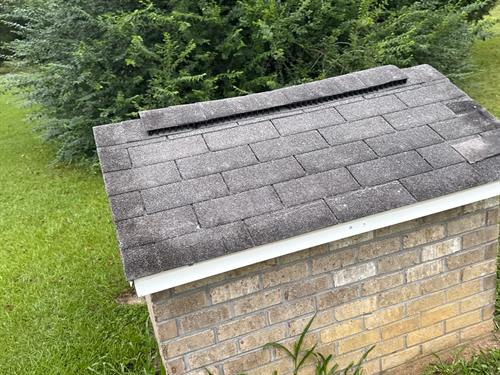 Even the little pump house gets a new roof Before 