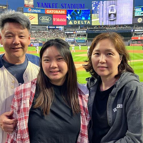 Mike and family enjoy premium tickets at Yankee Stadium after winning the league's annual raffle.