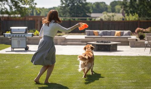 Gallery Image Brunette_Backyard_Playing_with_Dog.jpg