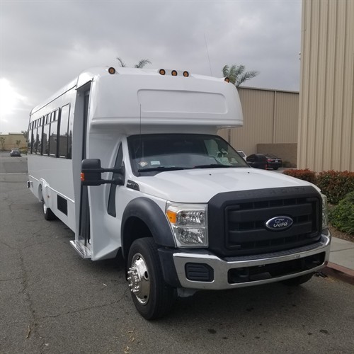 30-passenger party bus exterior. Vehicle availability requires confirmation.