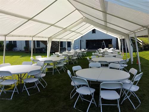 20X40 TENT WITH ROUND TABLES AND CHAIRS FOR OUTDOOR WEDDING