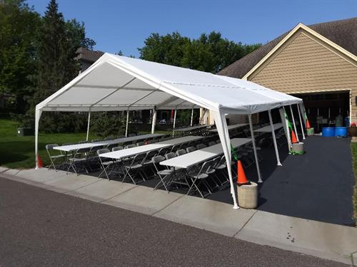 20X40 TENT, TABLES AND CHAIRS ON DRIVEWAY