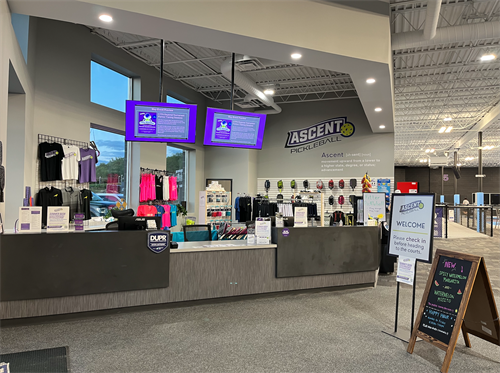 The front desk and pro shop inside Ascent Pickleball