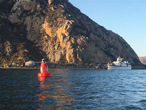 Morro Rock and tour boat from the ahrbor entrance