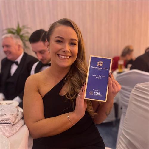 Mairead Kennedy showing off our Team of the Year award at the Fingal Chamber Awards 2022
