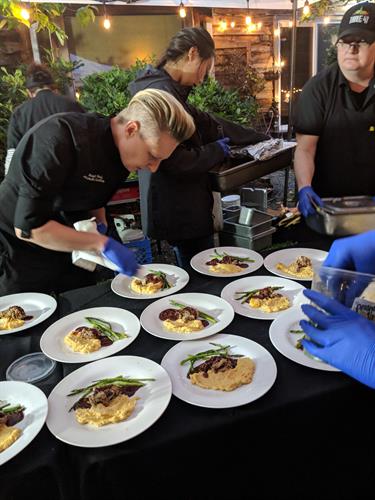 Catering Chef Michelle working on a plated dinner