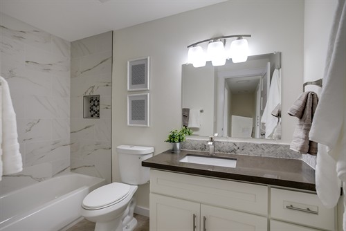 Bathroom remodel with a tiled tub surround, recessed niche and updated vanity. Bathroom remodel with a tiled tub surround, recessed niche and updated vanity.