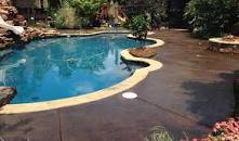 A stained pool deck, Color is bark brown and the sealed