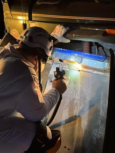 Removing rust and paint from a vintage jeep hood.