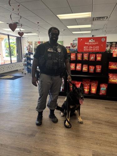 Bak and Officer Hall after Bak got a nose-to-tail makeover!