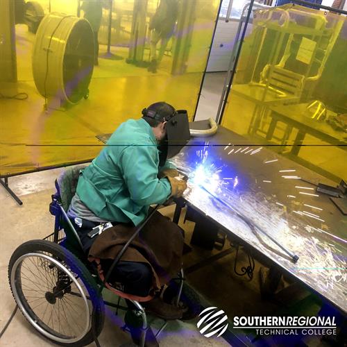 Welding student working with torch