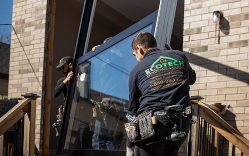 EcoTech Windows & Doors installer completing a professional energy-efficient window replacement for an Ontario homeowner.
