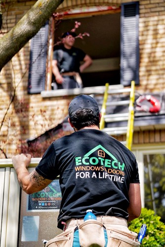 EcoTech Windows & Doors installation professionals completing an energy-efficient window replacement with expert workmanship and attention to detail.