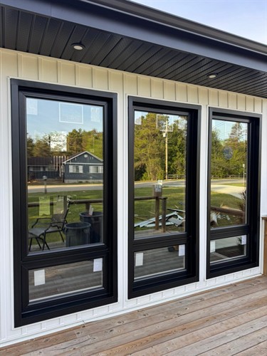 Black energy-efficient replacement windows professionally installed by EcoTech Windows & Doors to improve insulation, comfort and home value.