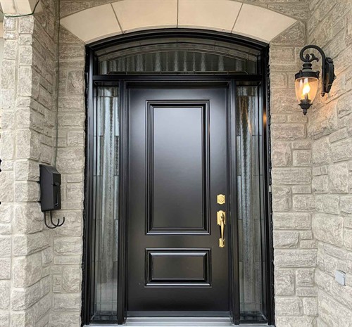 Modern black front entry door installed by EcoTech Windows & Doors, providing homeowners with improved energy efficiency, security and curb appeal.