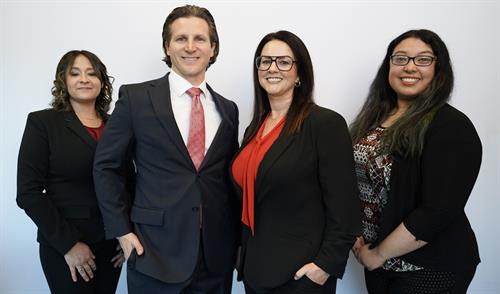 Attorney Brandon Gans and Attorney Julie Clark with supporting staff Attorney Brandon Gans and Attorney Julie Clark with supporting staff