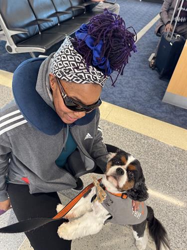 Buddy serving at DFW Airport for a blind traveler.