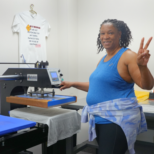 Customer Using the Free Heat Press Room at DTF Dallas